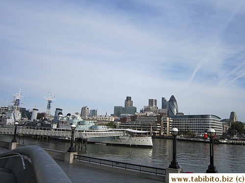 The bullet-shaped building on the right side of the picture is the Swiss Re Building, also known as the Gherkin