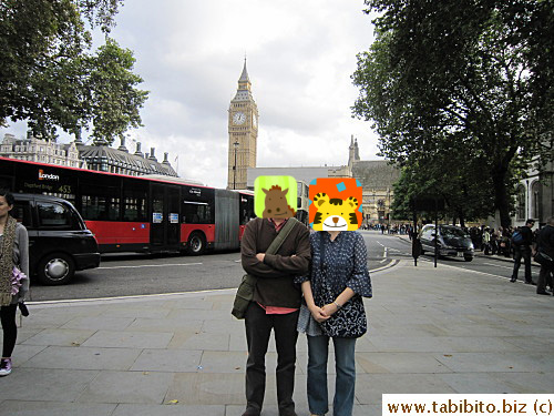 The tour guide's work at stops seems to be taking pictures for everybody