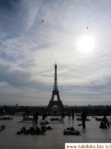 Eiffel Tower, birds,sun and people