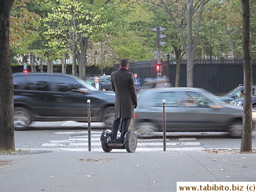 A man zips around on Zegway, how cool is that? (notice how much he's wearing and it wasn't even cold)