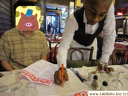 Waiters write on the table cover