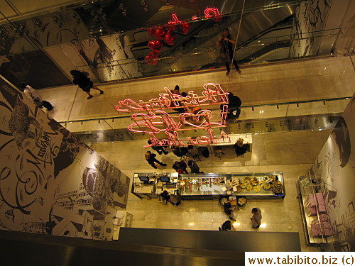 Shot from an escalator of a cake counter