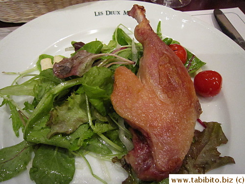 Confit de canard served with salad