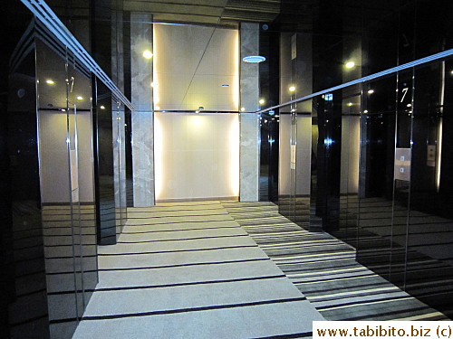 Bank of elevators and thick plush carpet throughout