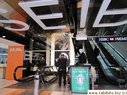 Which has escalators that lead to Nathan Road