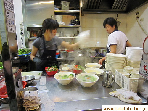 Busy open kitchen (lots of orders of Soup And Rice Sets from the look of it)
