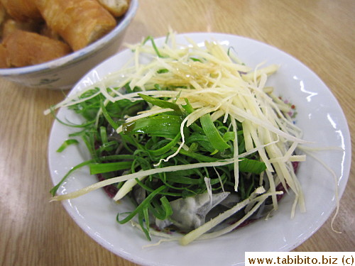 Fish skin comes with shredded ginger and scallions in a light soy and sesame oil sauce