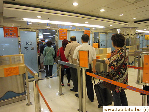 C queuing for security check for ferry passengers to Macau