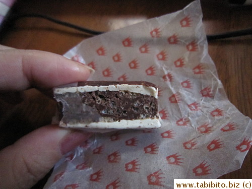 Peeling back the edible rice paper for a clearer picture of the candy
