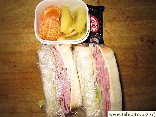 Ham & Cheese sandwich, kiwi, mandarin, KitKat
