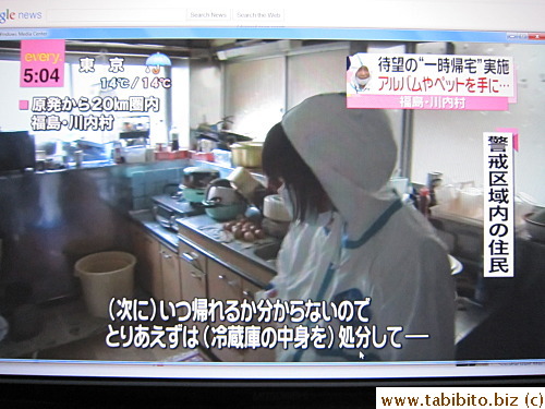 A woman cleans out the rotten food in the fridge and kitchen