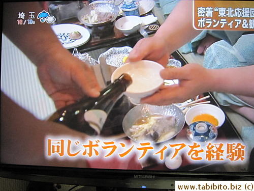 Staff poured sake for guests