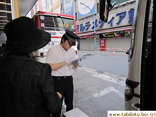 The bus driver checked tickets against the passenger list