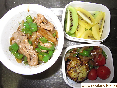 Sauteed pork with onion and bell peppers, panfried eggplant, cherry tomatoes, kiwi fruit