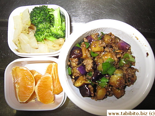 Stirfried pork mince with eggplant, sauteed broccoli, Chinese cabbage, orange 