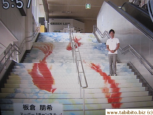 Stairs are painted with swimming goldfish in this train station to 