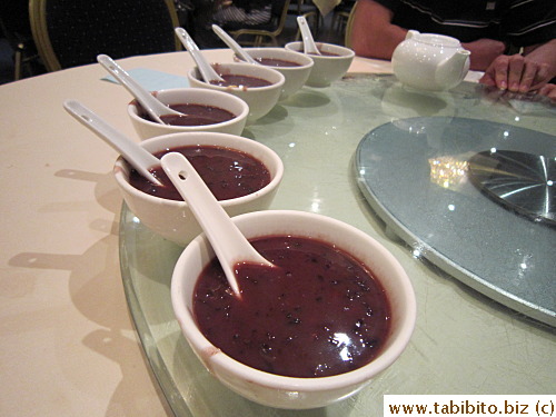 Here comes all this free dessert, starting with: red beans and black rice sweet soup with coconut cream or something