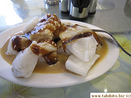 Delicious rice rolls with sweet sauce, sesame sauce, and soy