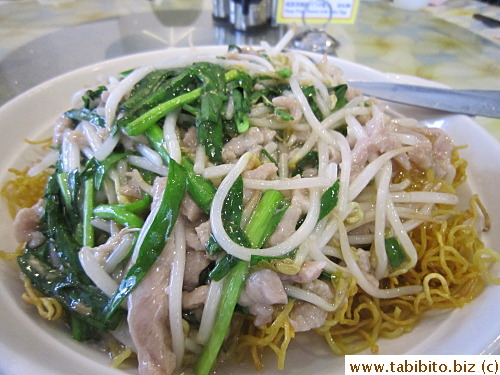 Shredded pork and veggies over crispy noodles
