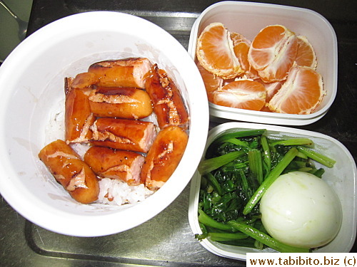 Fried sausages, sauteed spinach, soft-boiled egg, mandarin