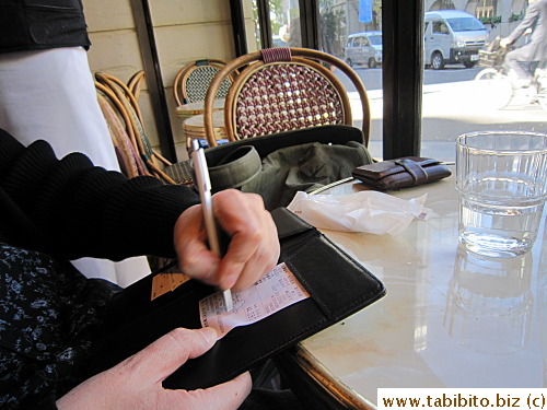 As in a typical French cafe in Paris, payment is made at the table (instead of at the cashier in most other restaurants)