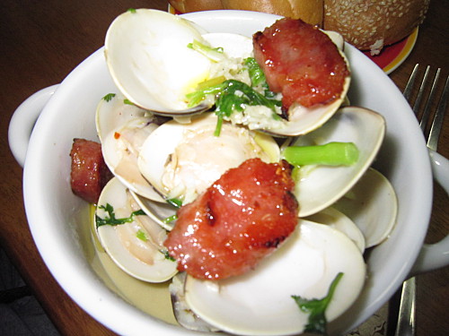 Our dinner: clams with garlic, white wine and coriander, topped with panfried crispy Black Bridge sausage, SUPER DELICIOUS!