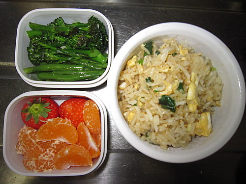 Egg fried rice, sauteed broccolini with garlic, mandarin and strawberries