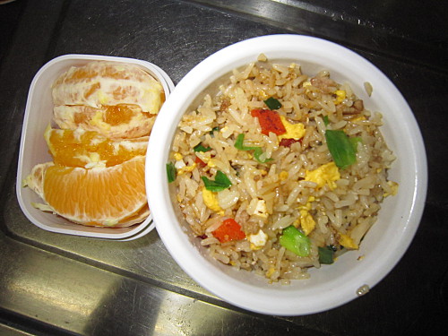 Fried rice with ground beef and veggies, orange
