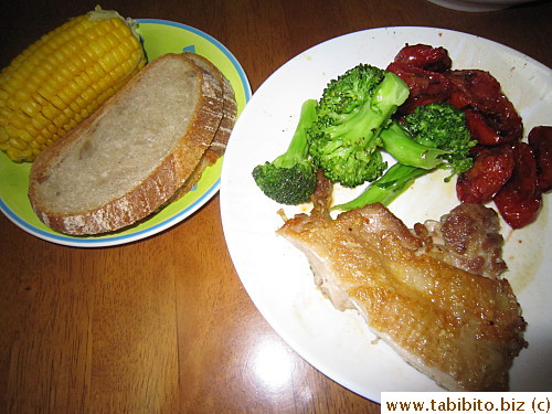 Dinner: panfried chicken, roasted tomatoes, sauteed broccoli, country bread and corn