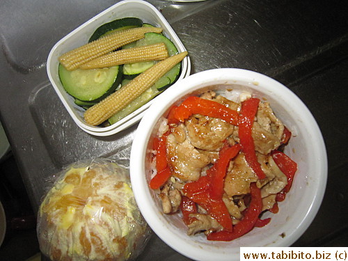 Stirfried pork and bell peppers, sauteed zucchini and baby corn, orange