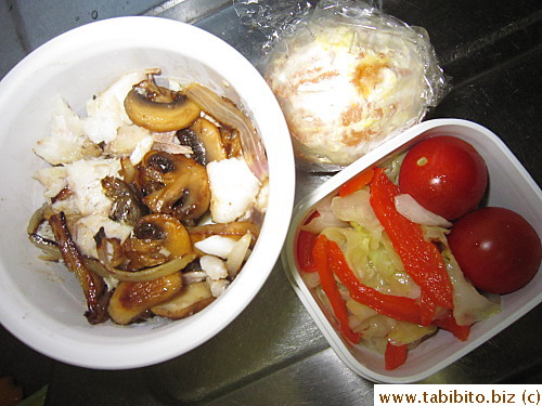 Grilled cod topped with mushrooms, sauteed cabbage and red peppers, cherry tomatoes, orange