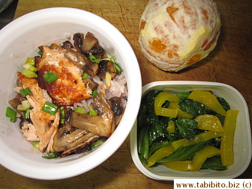 Grilled salmon with mushrooms, sauteed lettuce and peppers, orange