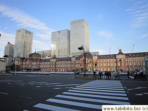 Crossing the wide road to the station