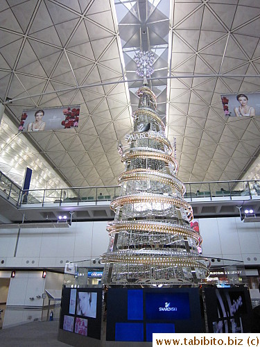 A giant Christmas tree made of tons of Swarovski crystals in Hong Kong Airport
