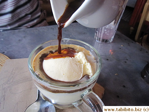 Pouring espresso over vanilla ice cream
