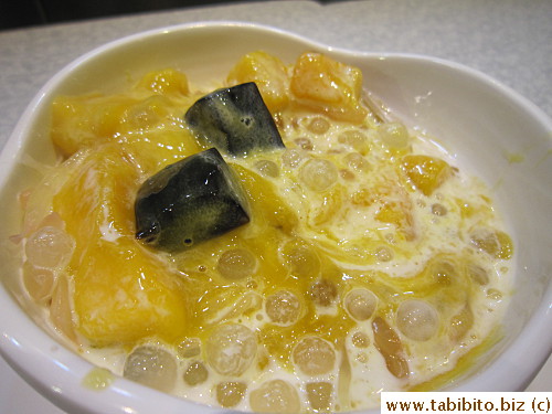 It had pomelo, mango, grass jelly cubes in coconut milk I think