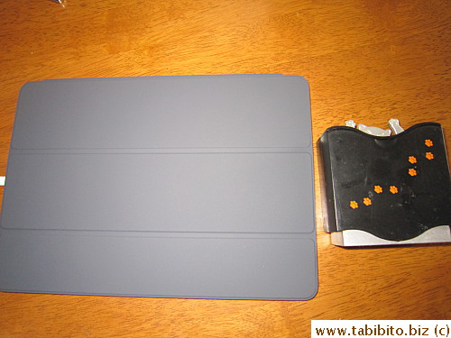 The black cover is more like gray (next to a true black object)
