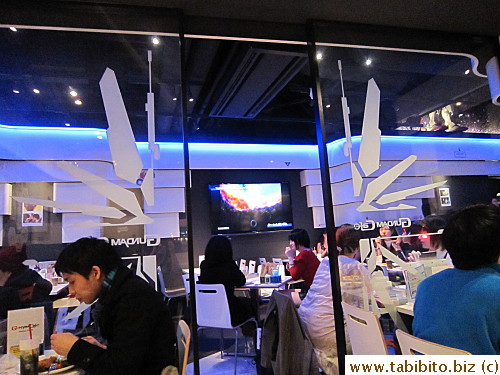 An adjacent larger dining room