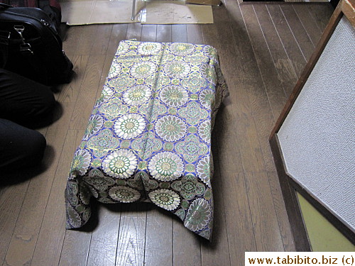 A pall is draped over the box before prayers