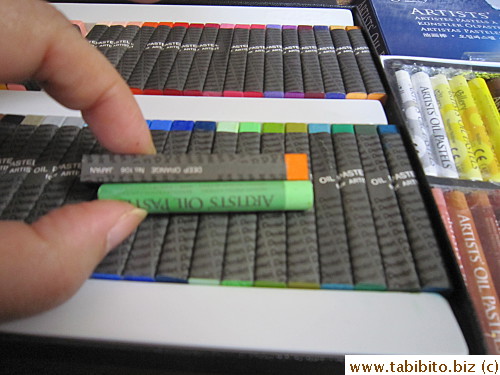 Mungyo is more creamy but produces copious amount of oily bits on the paper; and Pentel's colors are more vibrant