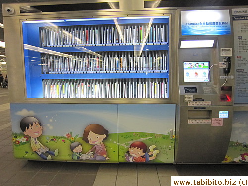 Self service library in a station, cool.